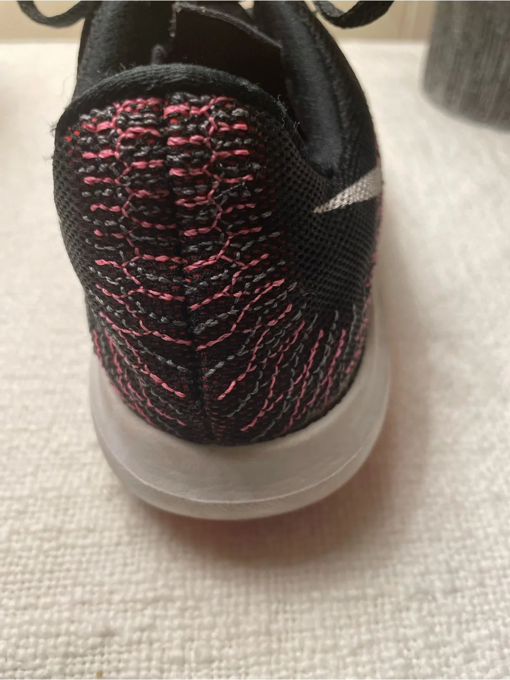 Nike Women’s Black and Coral Knit Running Shoe